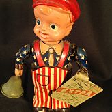 Vintage Occupied Japan tin and celluloid wind up toy NEWS BOY